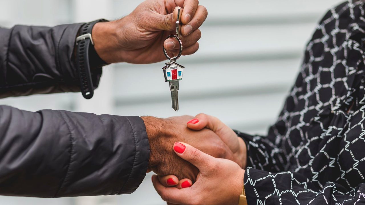 House keys exchanged at a closing table