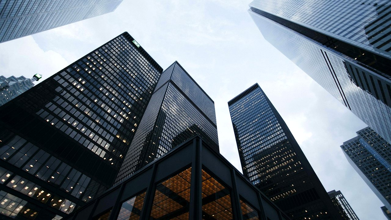 Modern glass architecture reflecting the sky