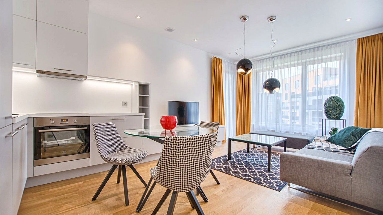Professionally staged living room with neutral tones